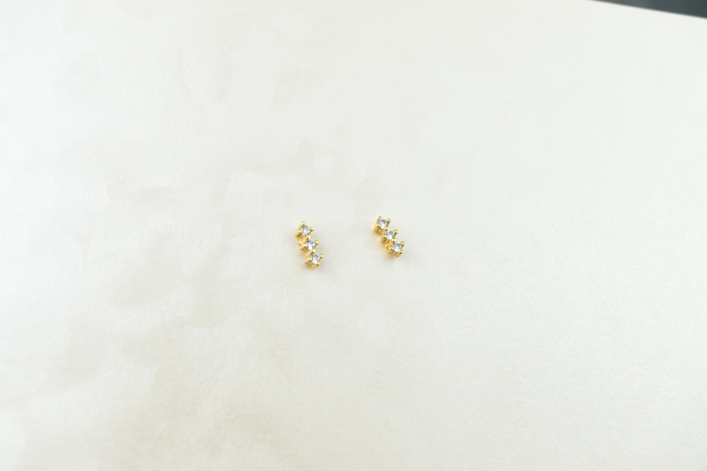 3 rombos de zirconia dorado