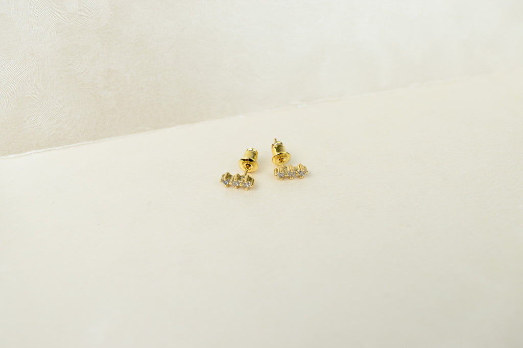 3 rombos de zirconia dorado