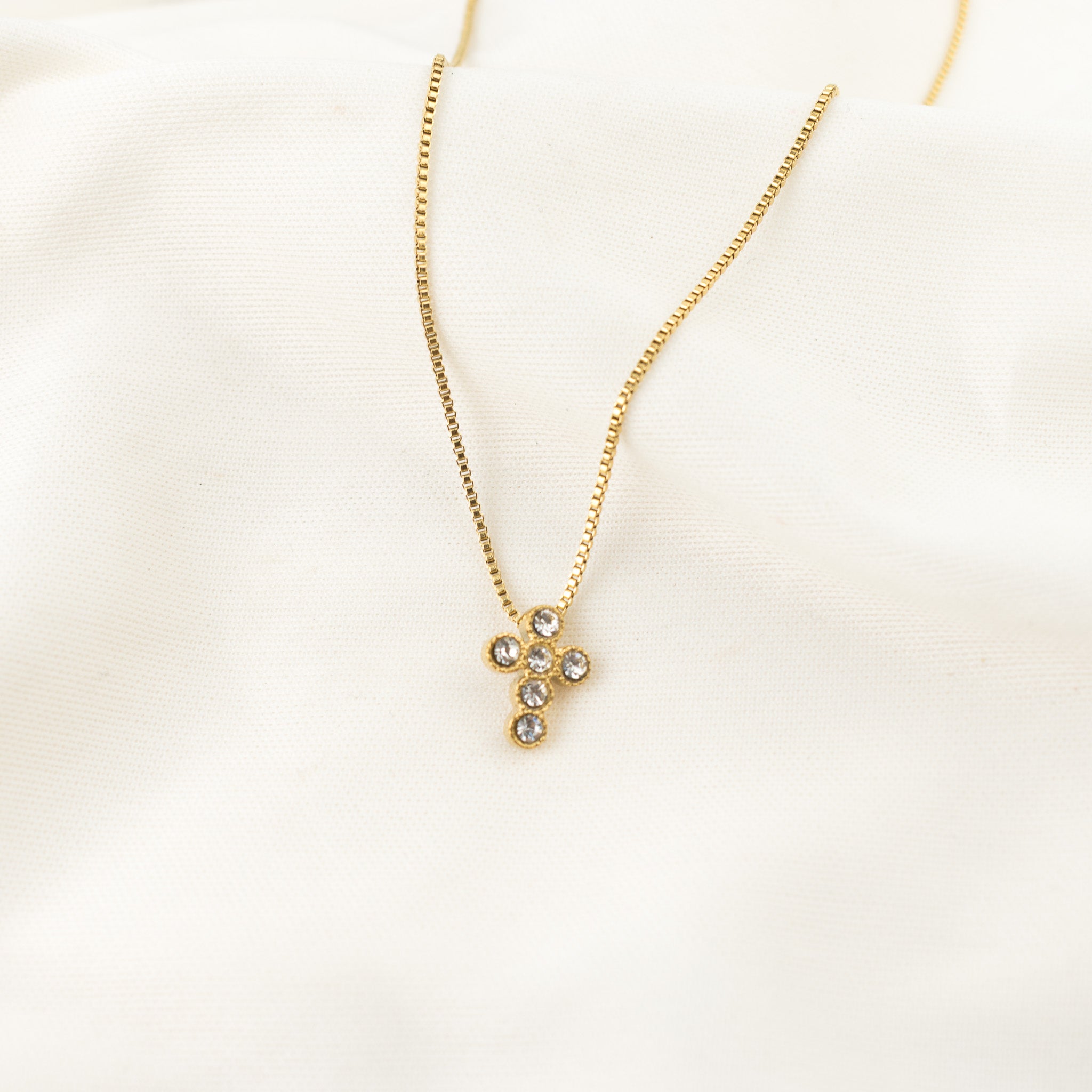 Cruz de círculos dorado