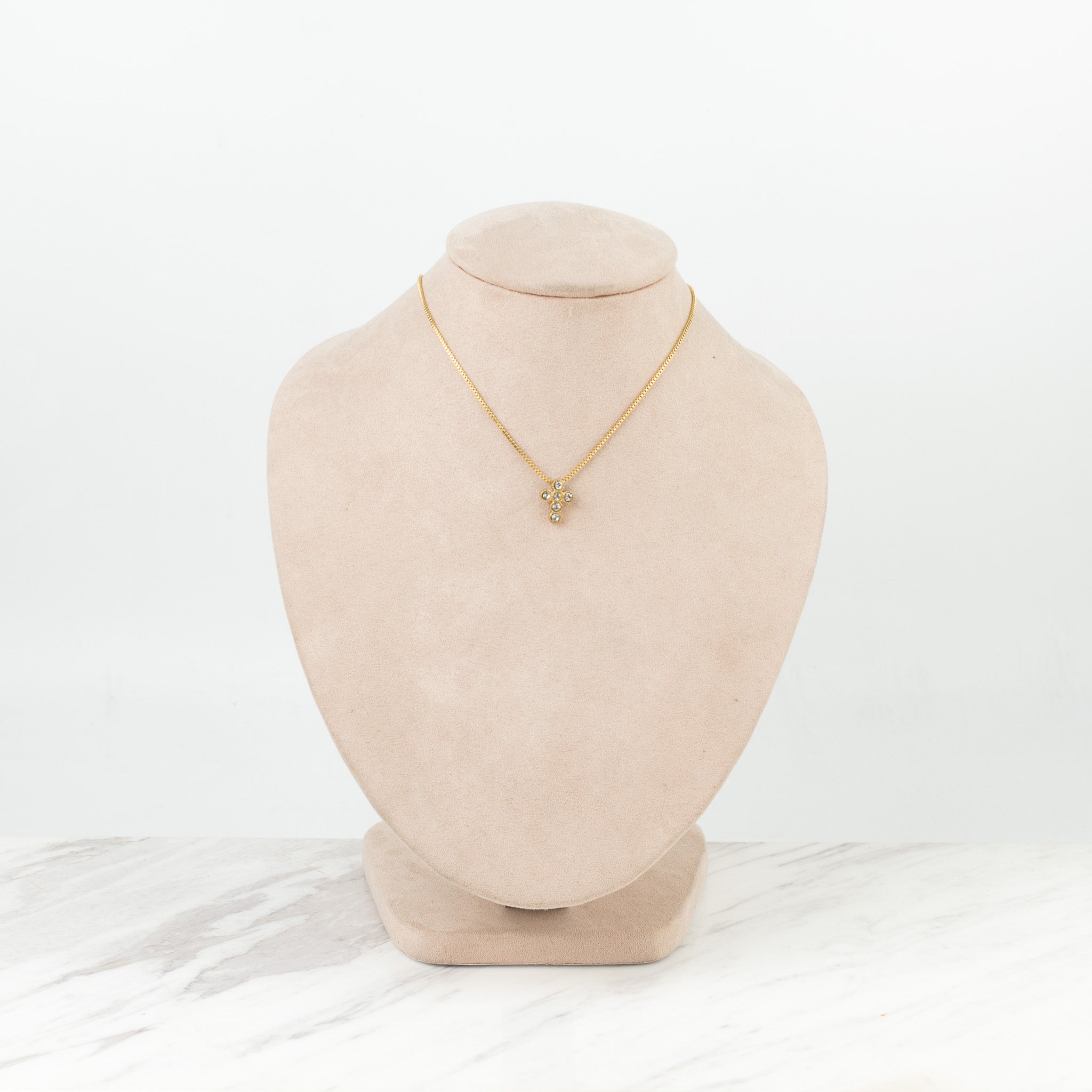 Cruz de círculos dorado