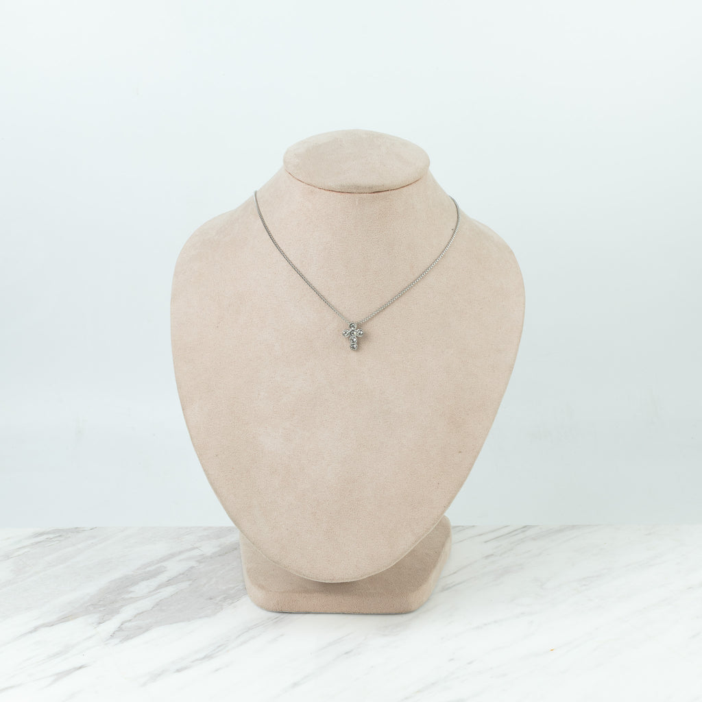 Cruz de círculos plateada