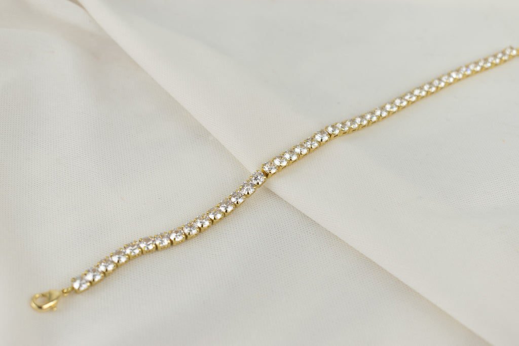 circular golden tennis bracelet