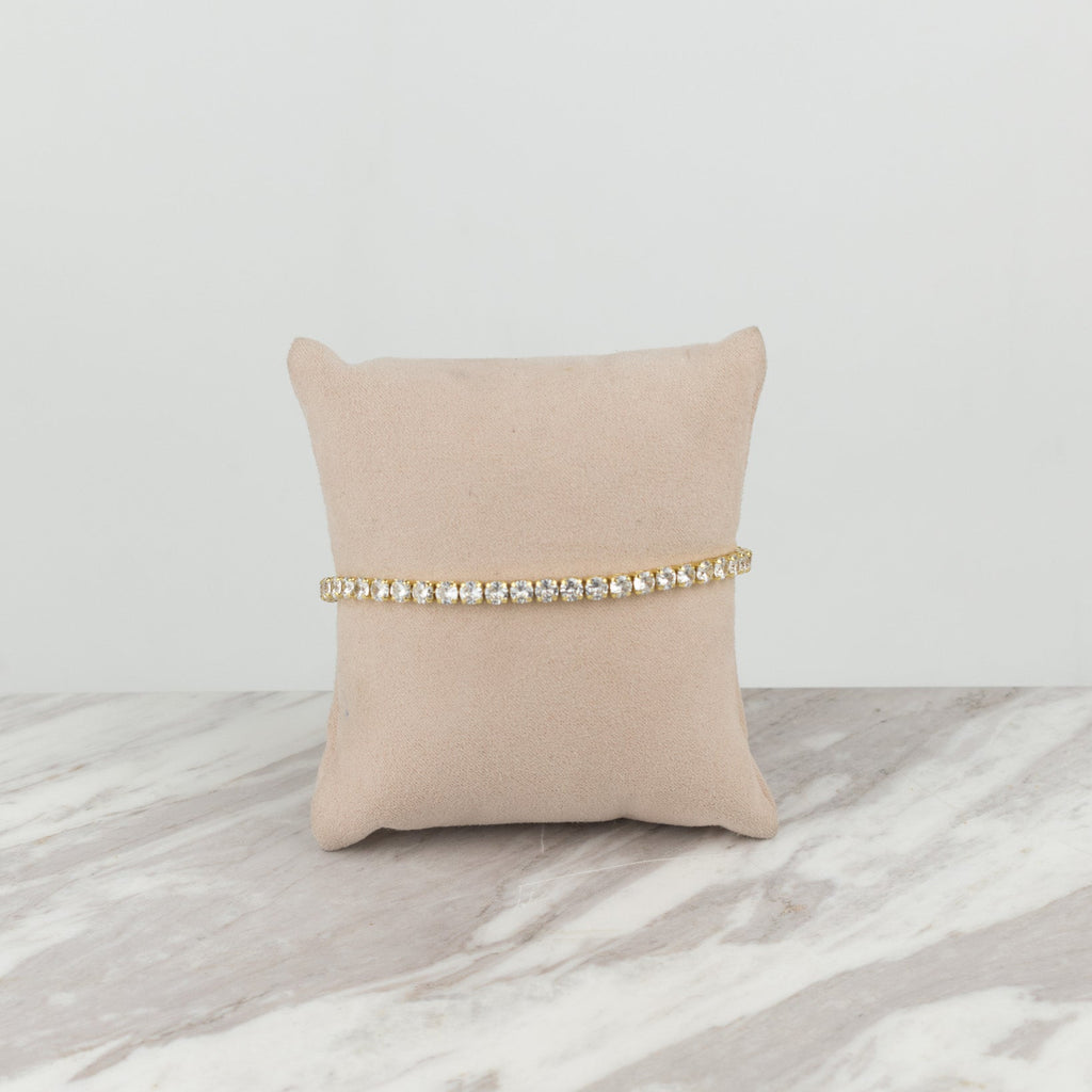 circular golden tennis bracelet