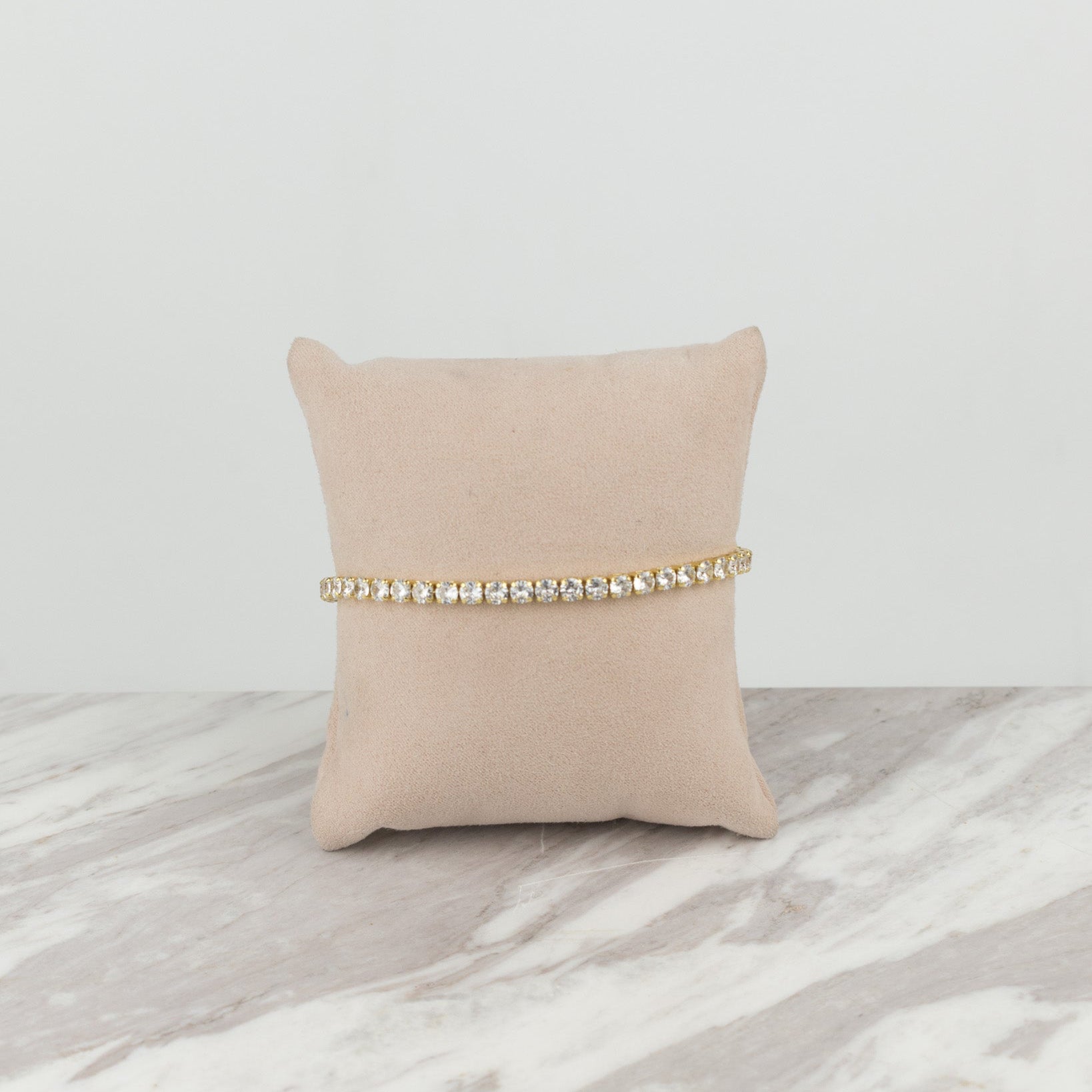 circular golden tennis bracelet