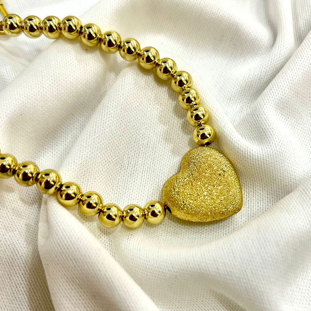 Pursers con bolitas y corazón chunky dorado